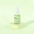 Sérum exfoliant anti-imperfection bio sur fond blanc – soin visage naturel